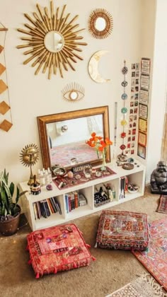 a living room filled with lots of furniture and decor on top of carpeted flooring