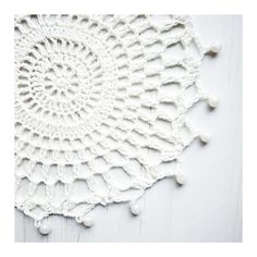 the white crochet doily pattern is shown