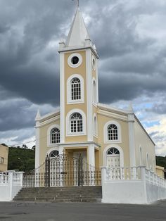 an old church with a steeple and white trim on the front door is shown