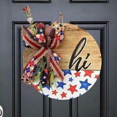 a patriotic wreath on the front door of a house