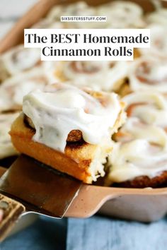 the best homemade cinnamon rolls with icing on top in a baking pan, ready to be eaten