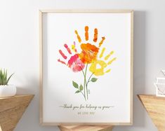 a hand print with the words thank you for helping us grow and flowers on it