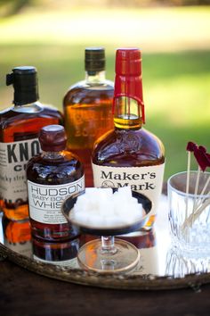 several bottles of liquor sitting on top of a table