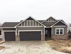 a house that is under construction in the middle of an empty lot with no cars