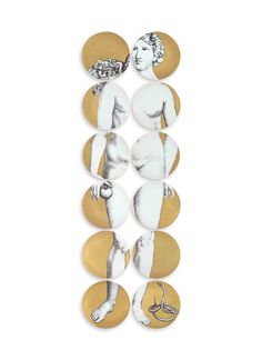 a white and gold wall hanging with images of women on it's sides, in the shape of circles