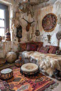 an old room with lots of furniture and rugs