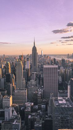 an aerial view of new york city at sunset