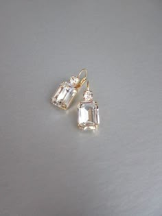 "These beautiful elegant earrings are made with fancy emerald cut and round Swarovski crystals. Available in gold, rose gold and silver finish. Matching necklaces an the bracelet are also available and they are shown in the last two photos. - 1 3/8\" long from the top of the ear wire to the bottom of the earring and 1/2\" wide - Leverback - For the matching bracelet please take a look here: https://www.etsy.com/listing/754440549/swarovski-crystal-bridal-bracelet-gold?ref=shop_home_active_19& Bridal Gold Earrings, Wedding Drop Earrings, Inexpensive Jewelry, Earrings Emerald, Gold Bridal Earrings, Wedding Earrings Drop, Matching Jewelry, Jewelry Lookbook, Earrings In Gold