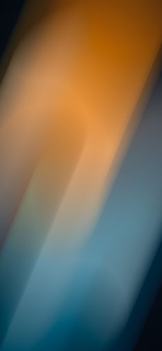 a blurry image of an orange and blue background