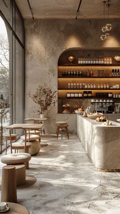 the interior of a restaurant with tables and stools