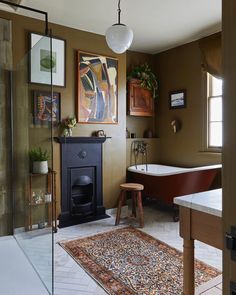 a bath room with a fireplace and a bath tub