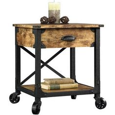 a wooden table with wheels and a candle on top