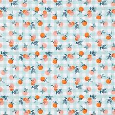 an orange and blue checkered fabric with small leaves on it's sides,