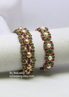 two bracelets on top of each other with pearls and colored stones in the middle