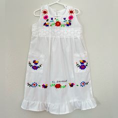 Traditional Girls Dress Made In El Salvador. Embroidered With Colorful Flowers, Birds, Suns. It Has 2 Front Pockets. Ruffle Hem. Labeled As Size 6 But Typically Run Small. Compared To American Brands This Would Be A Size 4-5 And Should Look Like A Midi To Maxi Dress. New Without Tags- Never Been Used. They Don’t Put Tags On Folkloric Dresses In El Salvador. Folkloric Dress, Sunshine Dress, American Brand, Dress Girls, The Sunshine, Girls Dress, Kids' Dresses, Ruffle Hem, Colorful Flowers