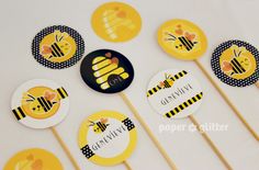 bee themed cupcake toppers with honeycombs on them