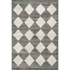 a gray and white rug with diamonds on it