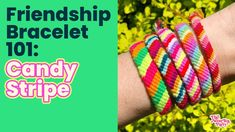 two hands holding colorful bracelets with the words candy stripe on them