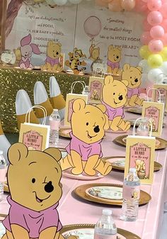 winnie the pooh birthday party with pink and gold decorations