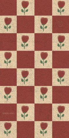 a red and white checkered pattern with flowers on it