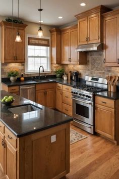 a large kitchen with wooden cabinets and black counter tops, an island in the middle