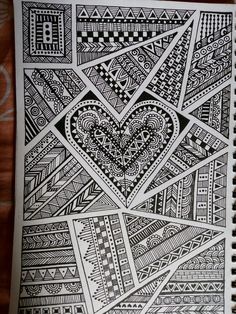 a notebook with an intricate heart drawn on it