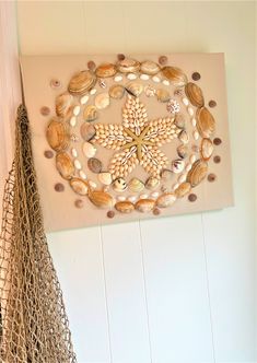 there is a wall decoration with seashells on it