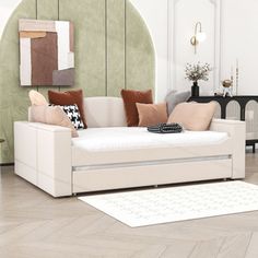 a living room filled with furniture and a rug on top of a hard wood floor