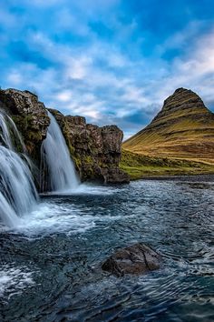 the waterfall is flowing into the water