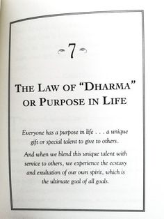 the law of dharma or purpose in life is written on an open book