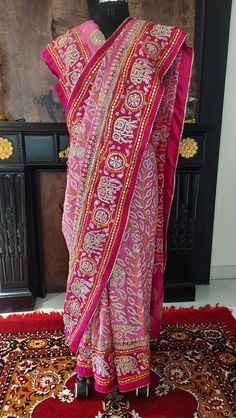 Our excellent workmanship  Our flagship gajji silk  pink shaded combination saree  handcrafted with beautiful BANDHANI/BANDHEJ work then glittering with zero size gota patti ,pearl work this is beautiful and luxurious drape for wedding.light golden work.with unstiched blouse piece . Luxury Bandhani Print Dola Silk Pre-draped Saree, Luxury Party Dupatta With Bandhani Print, Luxury Bandhani Print Paithani Silk Dupatta, Pink Silk Bollywood Pre-draped Saree, Bandhani Print Pre-draped Saree For Puja, Pink Silk Pre-draped Saree With Cutdana, Pink Silk Pre-draped Saree With Dori Work, Festive Pink Pre-draped Saree With Mirror Work, Pink Bandhani Print Pre-draped Saree For Festivals