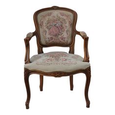 an old fashioned chair with floral fabric on the back and arm, sitting against a white background