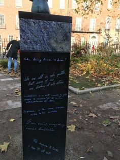 there is a statue with writing on it