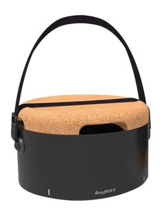 a black basket with a cork seat and handle