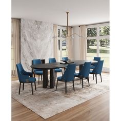 a dining room table with blue chairs in front of a marble wall and flooring