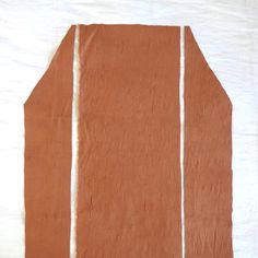 a piece of brown paper with white strips on it