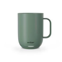 a green mug with the word ember on it is sitting in front of a white background