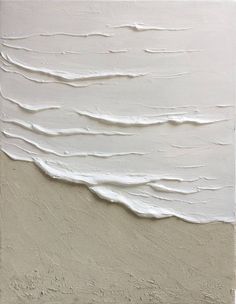 an abstract painting with white paint and waves on the wall, in neutral tones that appear to have been painted over