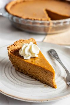 a slice of pumpkin pie with whipped cream on top