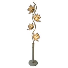 a lamp that has three flowers on it