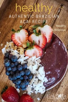 the cover of healthy authentic brazilian acai recipe, with strawberries and blueberries