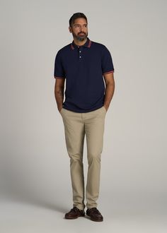 Men's Tall Polo Shirts that Elevate Your Style Game Elegance in Every Thread Our Contrast Tipped Polo Shirt for tall men is a celebration of refined taste and sophisticated style. Featuring a sleek tipped rib collar and sleeve cuff, this extra-long polo shirt is the epitome of class and comfort. Wear it on the golf course or for lunch in the city and stand tall knowing you're looking your best. Pique fabric polo with colored rib accents for a stylish edge Modern fit with a 3-button placket, addi Polo Business Casual Men, Polo Work Outfit Men, Classic Fitted Polo Shirt For Semi-formal Occasions, Elegant Semi-formal Polo Shirt, Classic Polo Collar T-shirt With Button-up, Mens Polo Shirt Outfit Classy, Blue Polo Outfit Men, Mens Polo Shirt Outfit, Casual Polo Shirt With 4-way Stretch