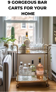 a bar cart with bottles and glasses on it in front of a window that says, 9 gorgeous bar carts for your home