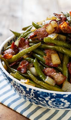 green beans with bacon in a blue and white bowl on a striped napkin next to an image of the same side dish