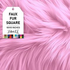 a pink fur texture with a white tag hanging from it's center and the words faux