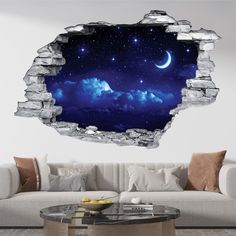 an image of a night sky with stars and moon through the hole in the wall