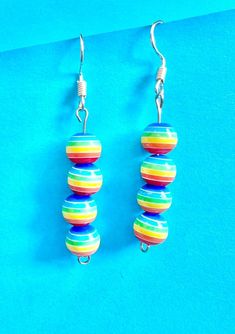 Ball rainbow stacker dangle earrings are fabulous and will go with any outfit because of their rainbow colours. The hook is made of plated sterling silver to protect your ears and the balls are made of Resin.  They come well presented and wonderful for a present for a friend, family or your loved one. I can gift wrap and post to an alternative address if they are a gift for a friend or relative.  Thank you for taking the time to look at my earrings and please visit my shop for more original desi Colorful Playful Dangle Earrings, Colorful Playful Dangle Jewelry, Playful Colorful Dangle Jewelry, Hypoallergenic Multicolor Sterling Silver Earrings, Colorful Vibrant Earrings With Ear Wire, Vibrant Rainbow Dangle Earrings, Fun Colorful Dangle Earrings, Colorful Fun Dangle Earrings, Vibrant Rainbow Drop Earrings