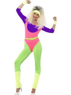 a woman in a pink and green bodysuit posing for the camera with her arms up