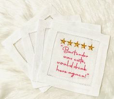 three embroidered napkins with gold stars on them that say, best friend when cute would drink here again