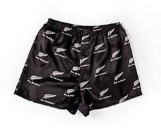 a pair of black swim trunks with white wings on them and the words,'i love